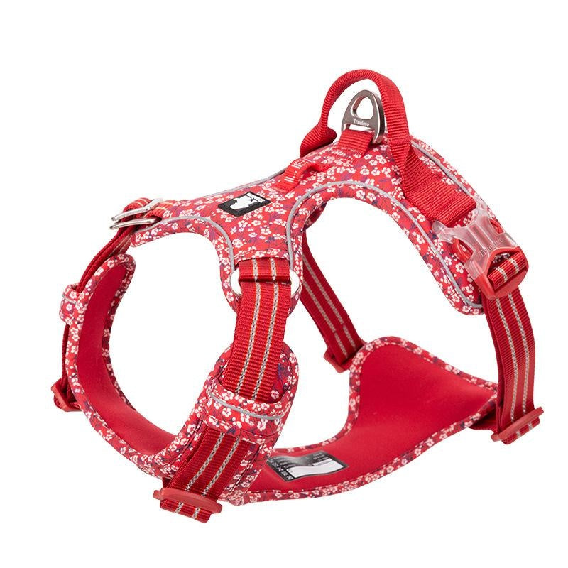 Red dog harness with floral pattern on a white background