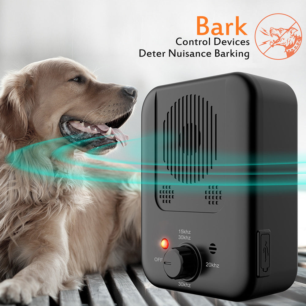 Dog barking control device with a dog in the background