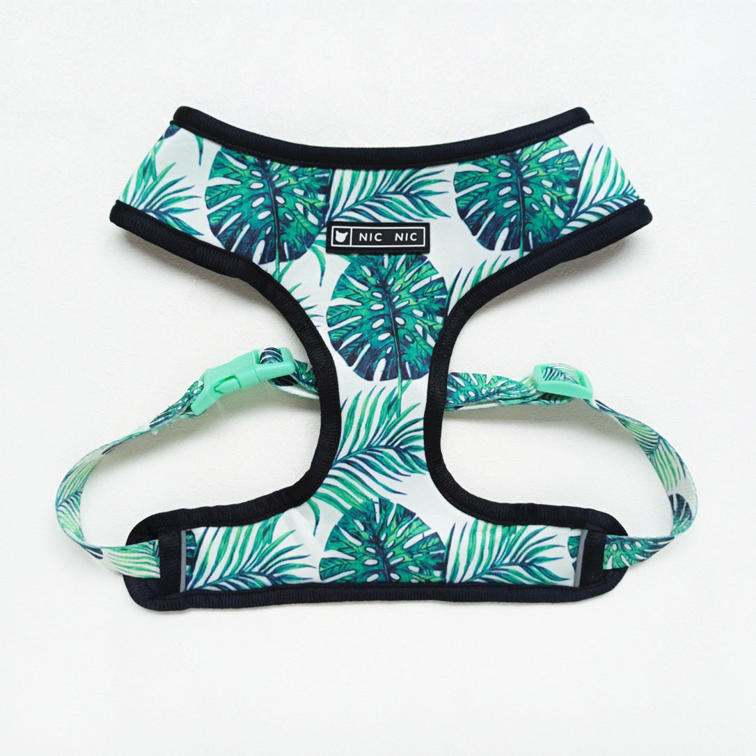 Tropical leaf patterned dog harness on a white background