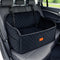 Black quilted car seat cover with orange logo in a vehicle