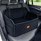 Black quilted car seat cover with orange logo in a vehicle