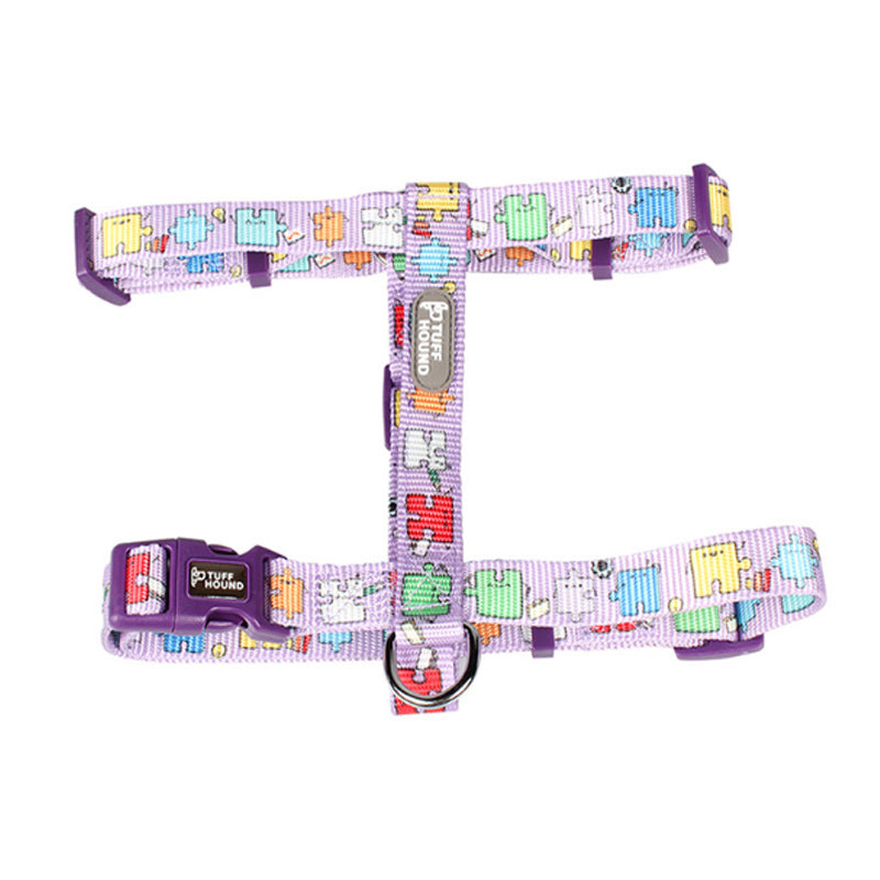 Dog harness with colorful puzzle piece pattern on a white background
