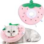 Cat wearing a strawberry-shaped cone collar with a close-up of the collar on a white background.