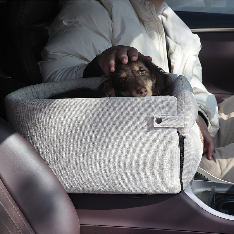 A portable car central dog seat bed, with small dogs inside, being used in a vehicle setting. The bed is shown in different angles, highlighting its design and use.
