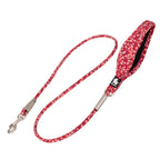 Red floral-patterned dog leash with a matching handle on a white background